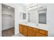 Bright bathroom featuring a double sink vanity, large mirror, and ample counter space, blending style and functionality at 6805 S 14Th St, Phoenix, AZ 85042