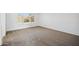 A light and airy bedroom with neutral carpet, large window and a clean, modern feel at 6805 S 14Th St, Phoenix, AZ 85042