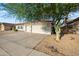 The property has low-maintenance landscaping, a terra cotta roof and an attached two-car garage with plenty of parking at 6805 S 14Th St, Phoenix, AZ 85042