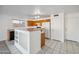 Open kitchen design with breakfast bar and efficient appliances, adjacent to living area at 6805 S 14Th St, Phoenix, AZ 85042