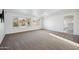 Sun-drenched living room with neutral carpet and walls, offering a blank canvas for personalization at 6805 S 14Th St, Phoenix, AZ 85042