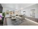 Bright and airy living room featuring stylish furniture, neutral tones, and abundant natural light at 6805 S 14Th St, Phoenix, AZ 85042