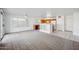 Spacious living room with natural light leading into a kitchen area at 6805 S 14Th St, Phoenix, AZ 85042