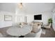 Bright open-concept living space featuring stylish furniture, neutral tones, and dining area creating a comfortable atmosphere at 6805 S 14Th St, Phoenix, AZ 85042