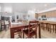 Elegant dining room with wood table and chairs, adjacent to the modern kitchen at 705 W Queen Creek Rd # 2062, Chandler, AZ 85248