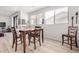 Bright dining area with wood table and chairs, featuring large windows at 705 W Queen Creek Rd # 2062, Chandler, AZ 85248
