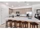 Spacious kitchen featuring stainless steel appliances and a large center island at 705 W Queen Creek Rd # 2062, Chandler, AZ 85248