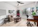 Comfortable living room featuring a sofa, desk, and bright natural light at 705 W Queen Creek Rd # 2062, Chandler, AZ 85248