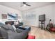 Cozy living room featuring comfortable sofas, a TV, and natural light at 705 W Queen Creek Rd # 2062, Chandler, AZ 85248
