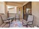 Cozy patio with seating, sliding glass doors, and neutral decor create a perfect space for relaxation at 705 W Queen Creek Rd # 2062, Chandler, AZ 85248