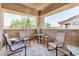Cozy covered patio with comfortable chairs and views of the neighborhood at 705 W Queen Creek Rd # 2062, Chandler, AZ 85248