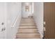 Bright, well-lit staircase with light wood flooring and a modern handrail at 705 W Queen Creek Rd # 2062, Chandler, AZ 85248
