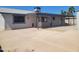 Spacious backyard featuring a large concrete patio and covered porch at 761 W Gail Dr, Chandler, AZ 85225