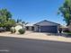 Single-story home featuring a well-maintained front yard with desert landscaping and a two-car garage at 761 W Gail Dr, Chandler, AZ 85225
