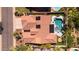 Aerial view showcasing the terracotta roof, solar panels, and the kidney-shaped pool in the backyard at 786 E Coconino Dr, Chandler, AZ 85249