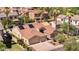 Beige home with a terracotta roof, two-car garage, landscaped yard, solar panels, and nearby homes at 786 E Coconino Dr, Chandler, AZ 85249