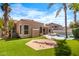 Green backyard with a patio, refreshing pool, and manicured landscape at 786 E Coconino Dr, Chandler, AZ 85249