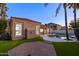 Beautiful backyard featuring a pool, artificial grass, and patio, creating a serene outdoor space at 786 E Coconino Dr, Chandler, AZ 85249