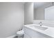 Clean, well-lit half bathroom with a modern vanity, faucet, and toilet at 786 E Coconino Dr, Chandler, AZ 85249