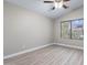 Bright, cozy bedroom with a ceiling fan, neutral paint, and updated flooring at 786 E Coconino Dr, Chandler, AZ 85249