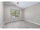 Cozy bedroom with vaulted ceilings, updated floors, and a large window at 786 E Coconino Dr, Chandler, AZ 85249