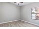 Inviting bedroom featuring stylish flooring, neutral colors, and large bright window at 786 E Coconino Dr, Chandler, AZ 85249