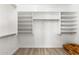 Walk-in closet offers adjustable shelving and hanging rods for optimal storage and organization at 786 E Coconino Dr, Chandler, AZ 85249