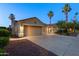 Charming home with a three-car garage, well-maintained landscaping, and warm exterior lighting at 786 E Coconino Dr, Chandler, AZ 85249
