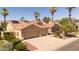 Charming beige home with a terracotta roof, two-car garage, and landscaped yard at 786 E Coconino Dr, Chandler, AZ 85249