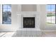 Living room featuring white tile fireplace and windows with neutral color palette at 786 E Coconino Dr, Chandler, AZ 85249
