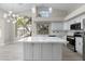 Modern kitchen featuring stainless steel appliances, stone countertops, and a large island at 786 E Coconino Dr, Chandler, AZ 85249