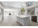 Spacious kitchen featuring a large center island, light wood floors and plenty of natural light at 786 E Coconino Dr, Chandler, AZ 85249