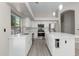 Beautiful kitchen with stainless steel appliances, stone countertops, ample cabinet space and an island at 786 E Coconino Dr, Chandler, AZ 85249