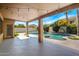 Spacious covered patio with views of a refreshing pool and manicured greenery at 786 E Coconino Dr, Chandler, AZ 85249