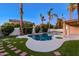 Beautiful backyard with pool, artificial turf, and mature palm trees, creating a private retreat at 786 E Coconino Dr, Chandler, AZ 85249