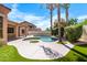 Beautifully landscaped backyard with artificial turf, mature trees, and a refreshing pool at 786 E Coconino Dr, Chandler, AZ 85249