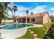 Sparkling backyard pool with mature palm trees and stepping stones, a true outdoor oasis at 786 E Coconino Dr, Chandler, AZ 85249