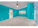 Bright bedroom with walkout to the backyard, carpeted floors, ceiling fan, and window at 833 S 113Th Ave, Avondale, AZ 85323