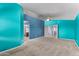 Spacious bedroom with walk-in closet, ceiling fan, and an ensuite bathroom in this home at 833 S 113Th Ave, Avondale, AZ 85323