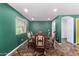 Dining room with tile floors, window, and decorative chairs in a home listed for sale at 833 S 113Th Ave, Avondale, AZ 85323