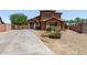 Charming two-story home featuring a xeriscaped front yard and a long concrete driveway at 833 S 113Th Ave, Avondale, AZ 85323