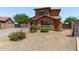 Beautiful two-story home boasting a well-maintained desert landscape and a terracotta exterior at 833 S 113Th Ave, Avondale, AZ 85323