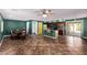 Spacious kitchen with tile floors, a breakfast bar, dark wood cabinets, and a sliding door to the patio at 833 S 113Th Ave, Avondale, AZ 85323
