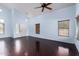 Spacious living room with soaring ceilings, hardwood floors, and bright natural light at 833 S 113Th Ave, Avondale, AZ 85323
