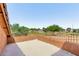A balcony with metal railings overlooks the street and lush green trees at 833 S 113Th Ave, Avondale, AZ 85323