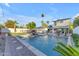 A backyard featuring a large in-ground pool with decorative fountains and mature landscaping at 908 E State Ave, Phoenix, AZ 85020