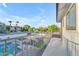 View from the deck overlooking the pool, backyard, outdoor kitchen, and lush landscaping of the property at 908 E State Ave, Phoenix, AZ 85020