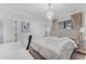 Bright bedroom featuring a chandelier and vanity with a mirror at 908 E State Ave, Phoenix, AZ 85020