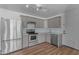 Well-equipped kitchen featuring stainless steel appliances, updated cabinets, and modern backsplash at 908 E State Ave, Phoenix, AZ 85020