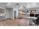 Open concept living space with adjacent kitchen, lots of light, and modern fixtures at 908 E State Ave, Phoenix, AZ 85020
